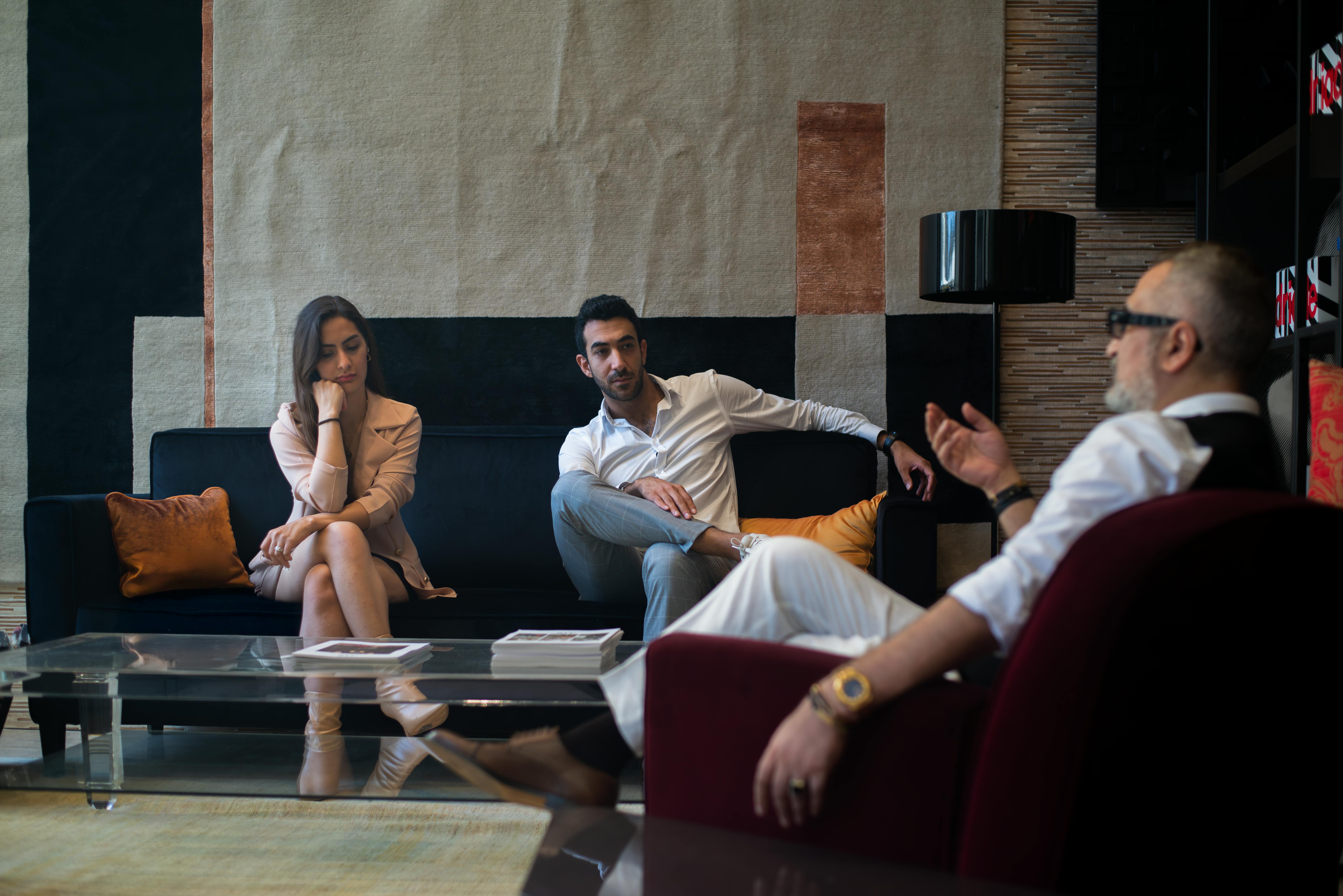 Three people in conversation